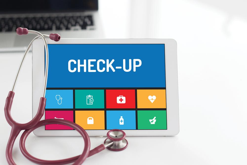 The image shows an iPad and a stethoscope